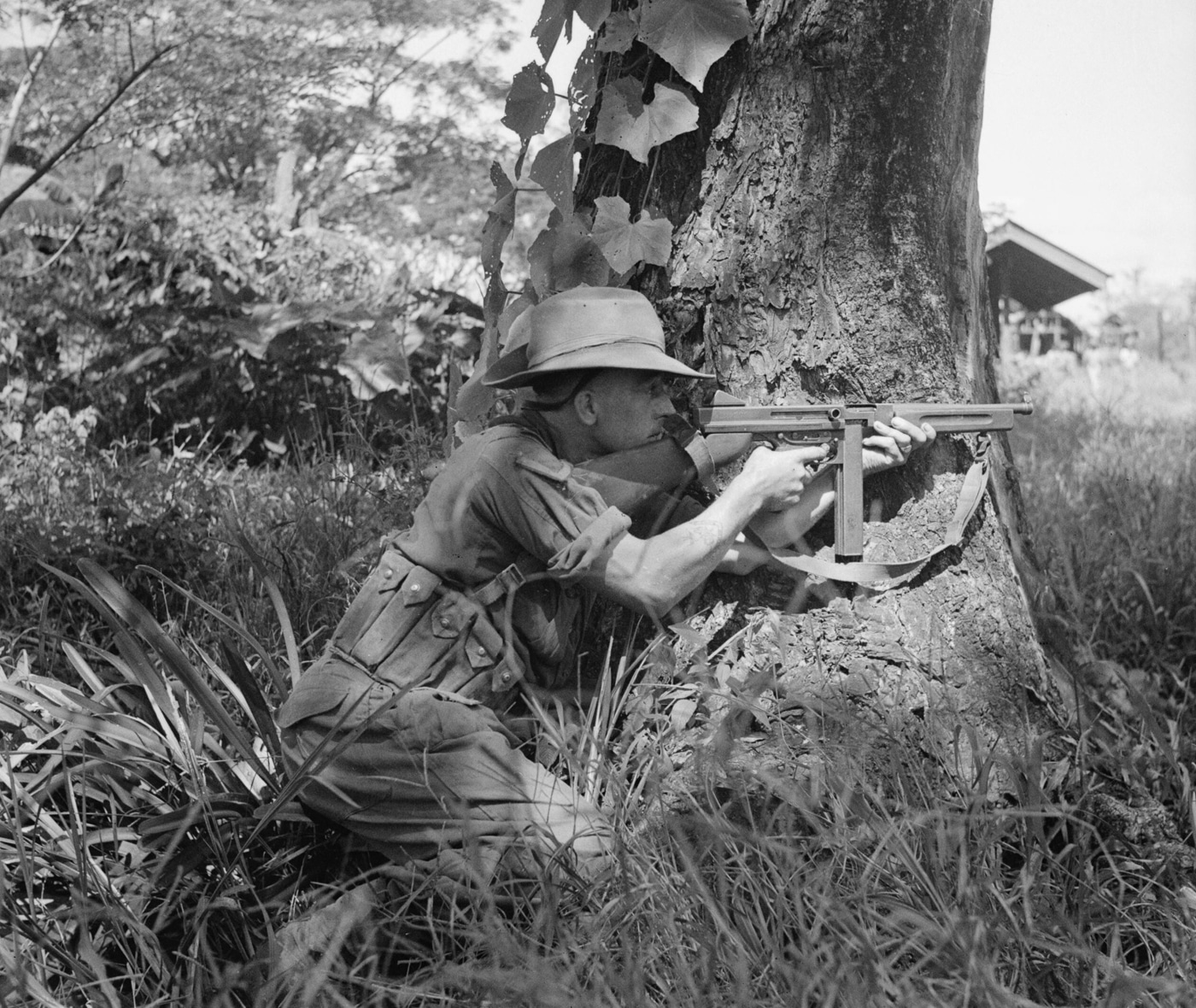 fusilier of Royal Scots provides cover fire with Thompson SMG against Japanese troops in Burma 1944