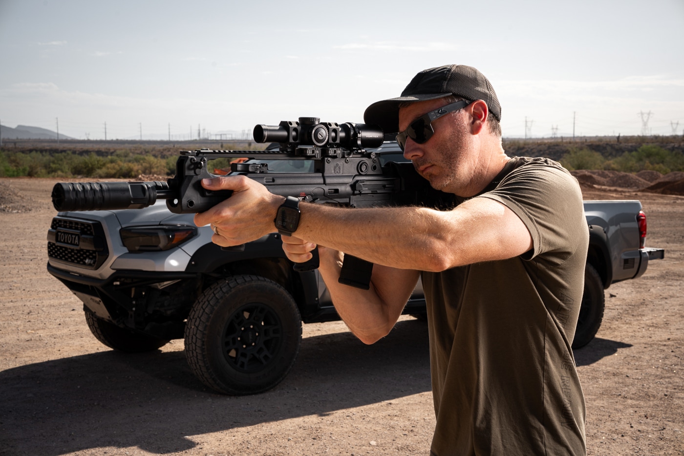 left side view of the author testing the JK Armament 172 PRO-KOR 556K mounted on a Hellion rifle