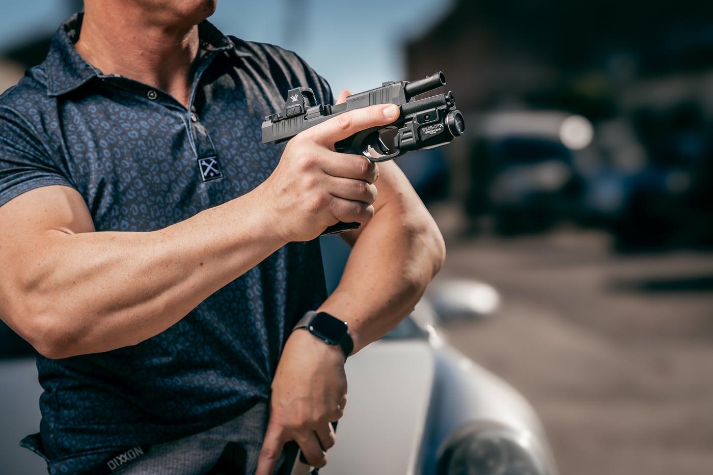 man reloading from slide lock during EDC training drill