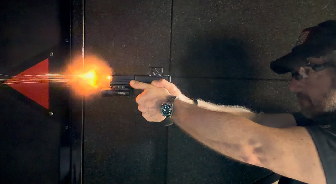 muzzle flash from Springfield Echelon in low light indoor range