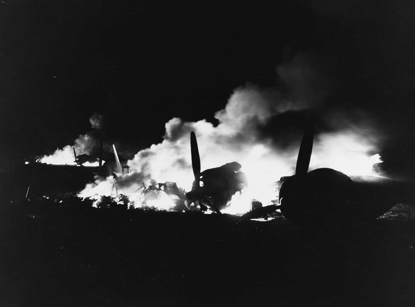 planes burn at Henderson Field in the wake of a Japanese attack