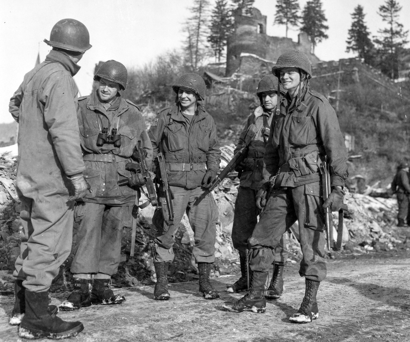 soldiers of US First and Third Armies meet in Belgium armed with Thompson SMGs