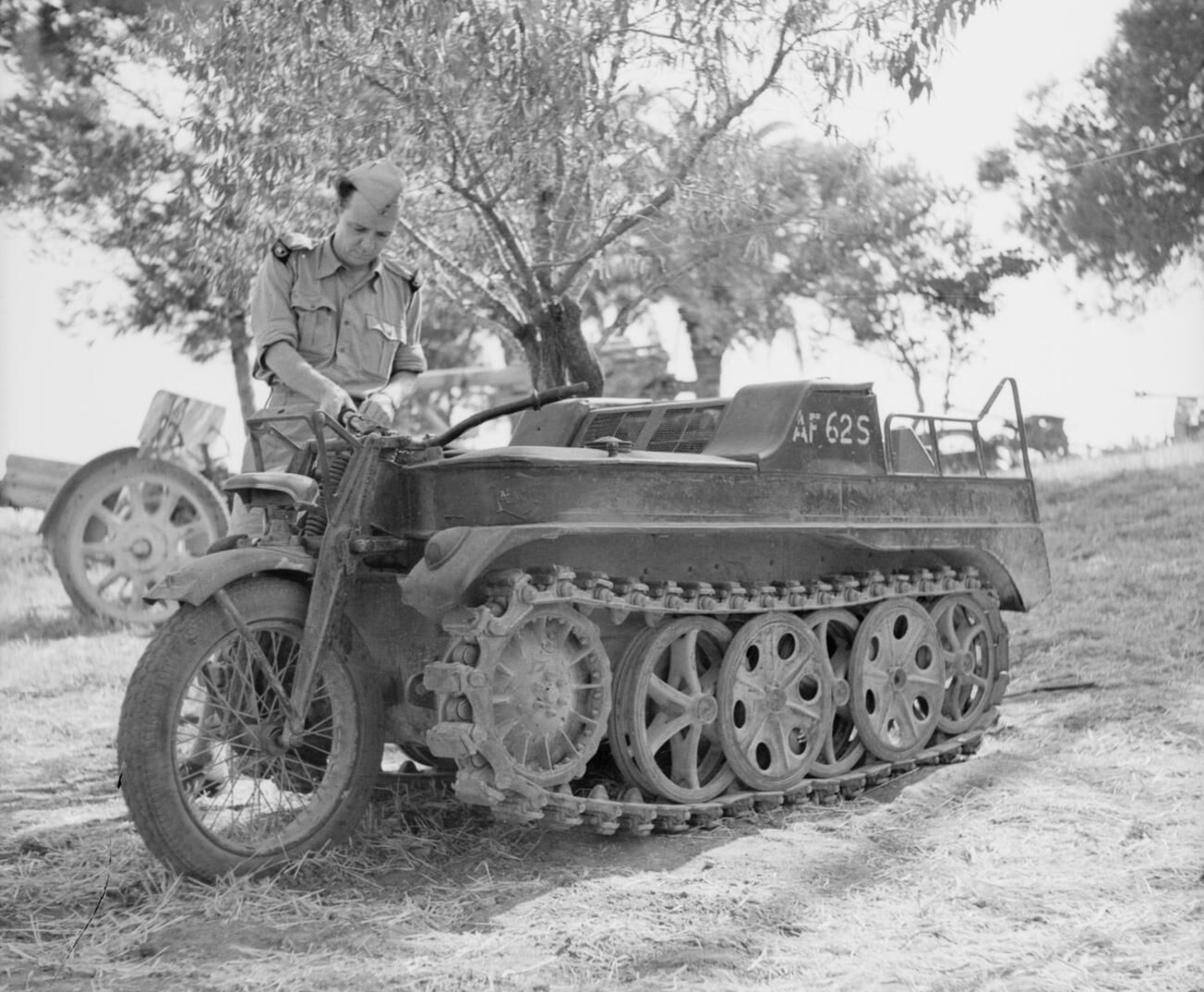 British soldier examines a captured Kettenkrad that had been used for towing small guns