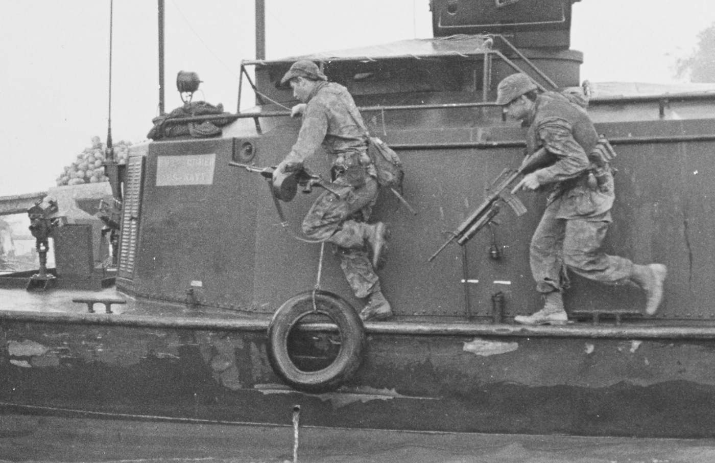 US Navy SEAL with Stoner 63A machine gun on boat in Kien Hoa Province Vietnam