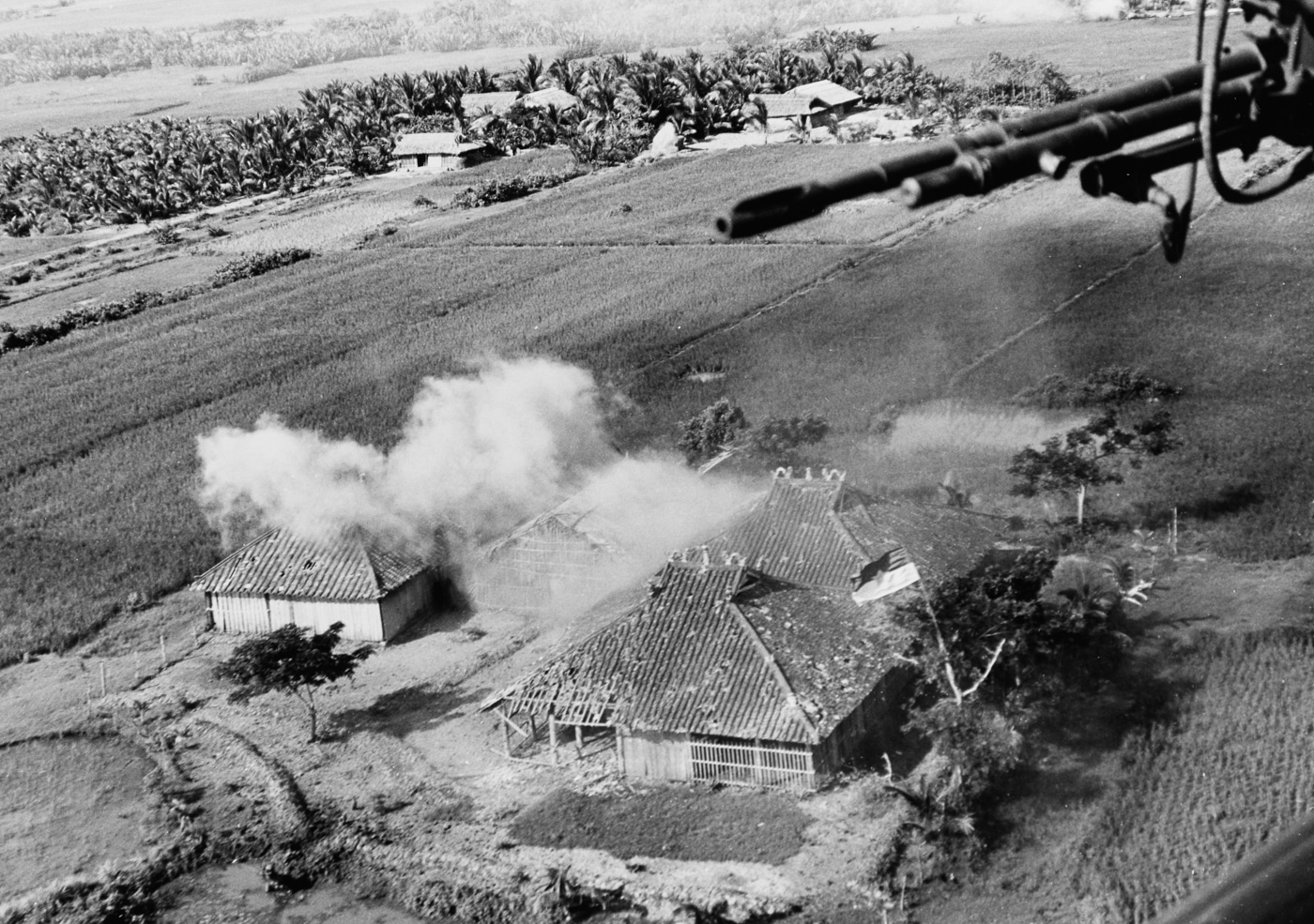 Vietcong camp is hit by machine gun and rocket fire from two HAL-3 UH-1B helicopters