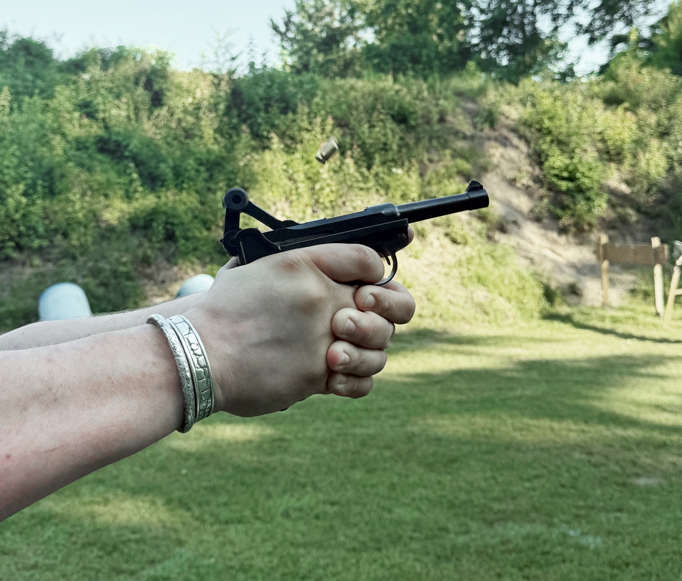 commercial Luger recoiling when shot at the range by the author