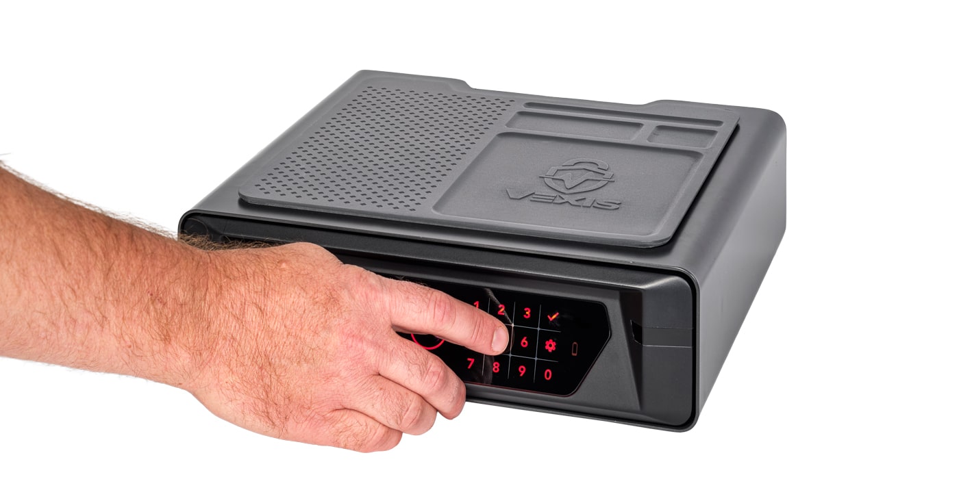 man using keypad on Hornady Vexis safe
