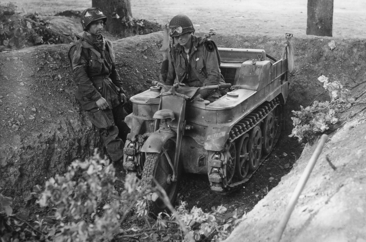 members of the US 101st Airborne examine a captured German Kettenkrad in France during Operation Overlord