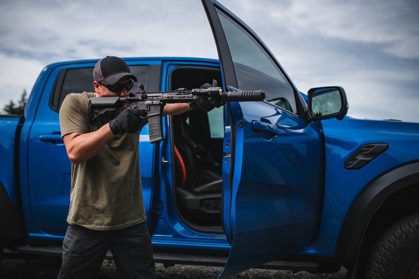 Springfield Armory SAINT Victor rifle equipped with sound suppressor shoots next to his truck MAX JACOBSEN