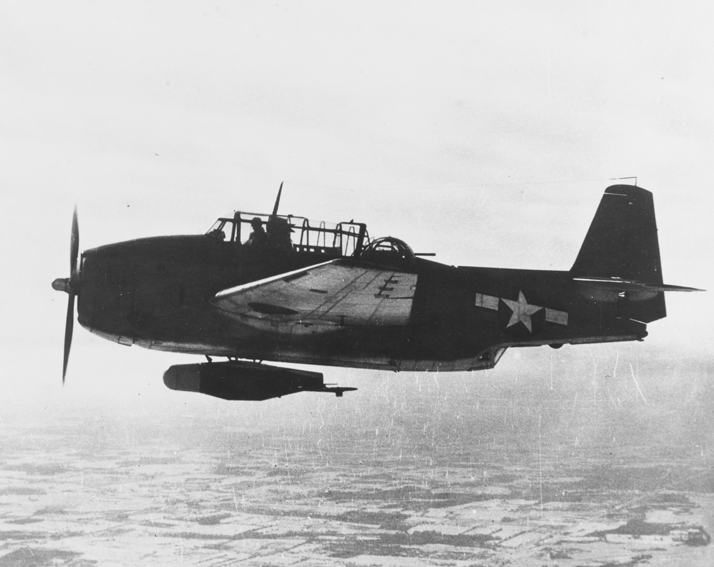 TBM Avenger carries Bat glide bomb in flight