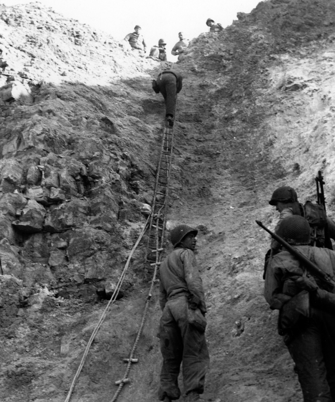 US Army Rangers make their way up a cliff