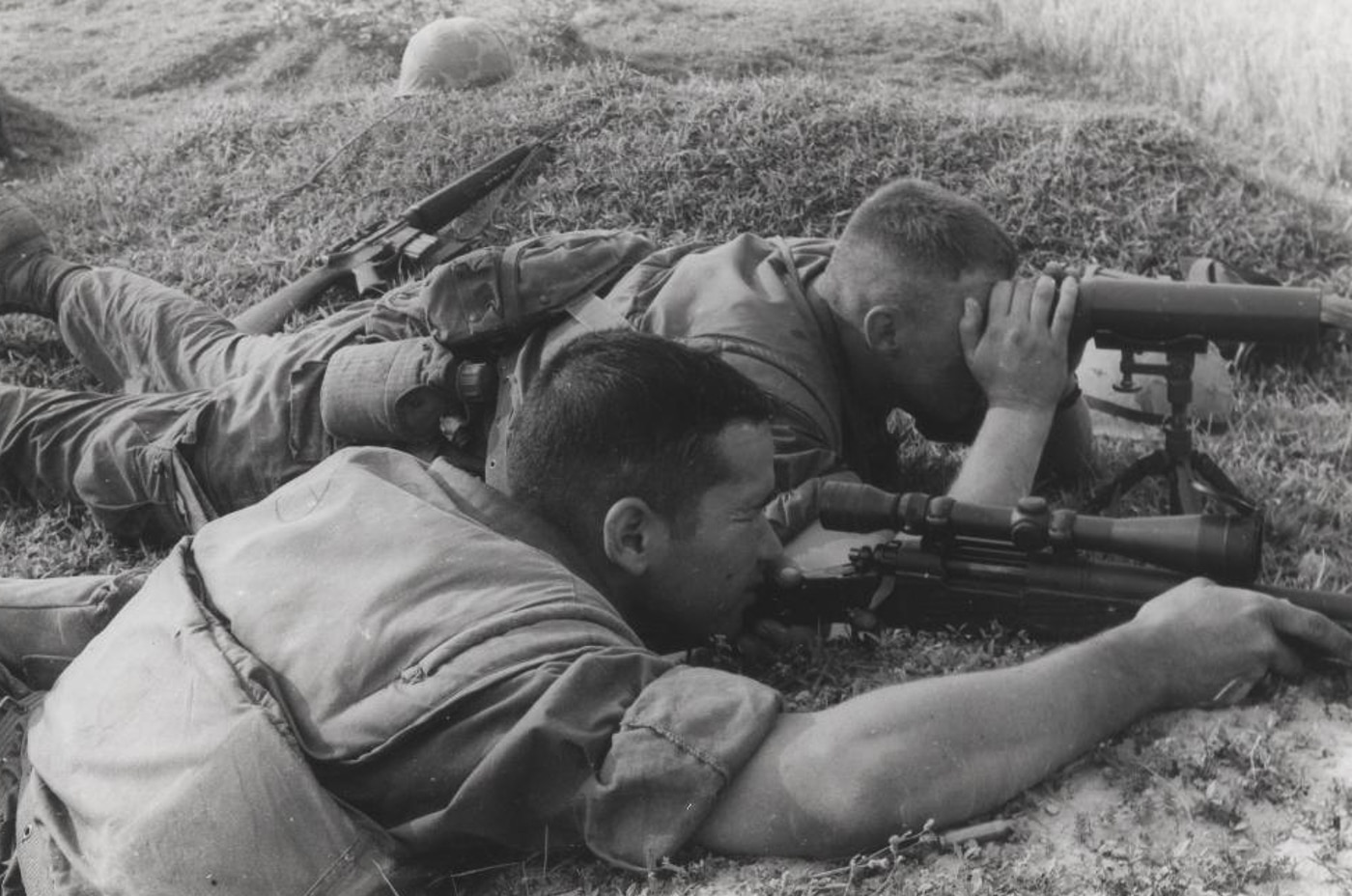 US Marine sniper team engages enemy troops with M40 rifle during the Vietnam War