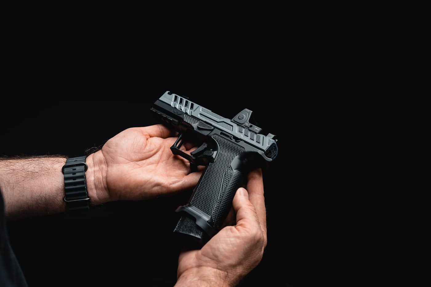 author holding the custom pistol in his hands showing the handgun