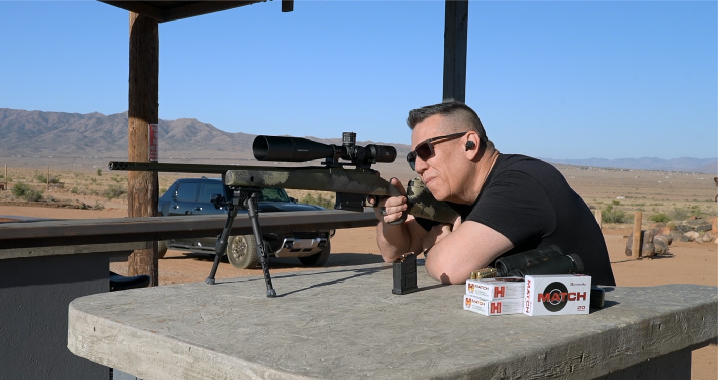 author shooting the Waypoint from a bench on the 1000 yard range