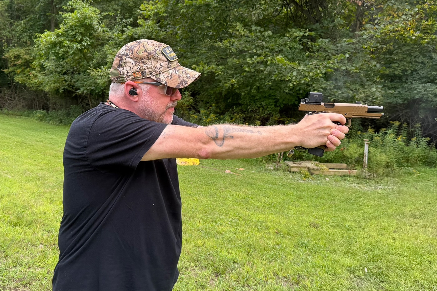 author testing the Meprolight MPO PRO F at an outdoor shooting range