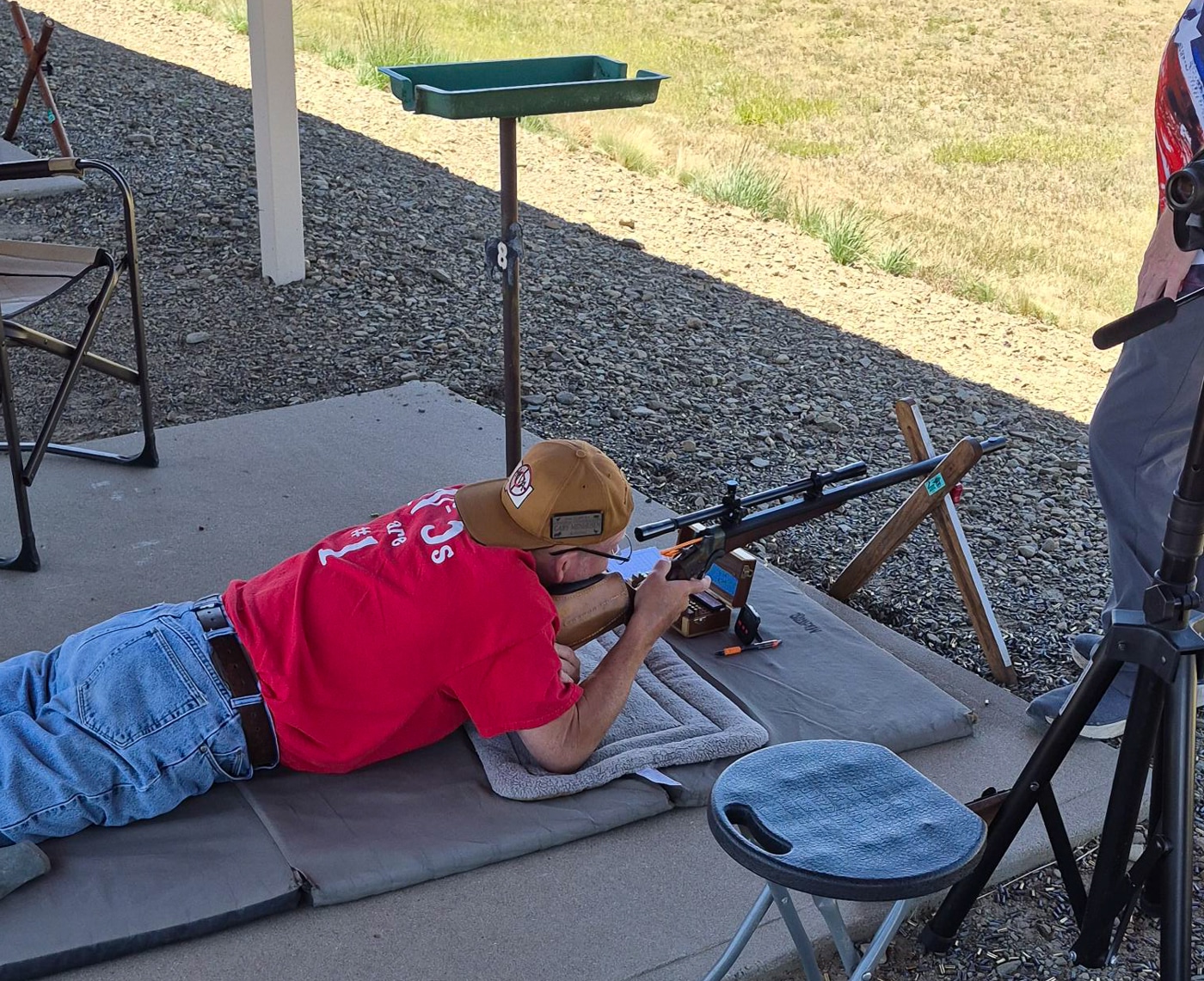 man lying prone shooting a rifle at the range