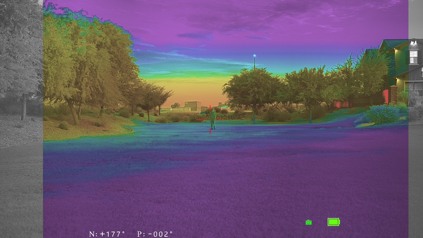 night vision and thermal image of man in field with M1 Pro monocular