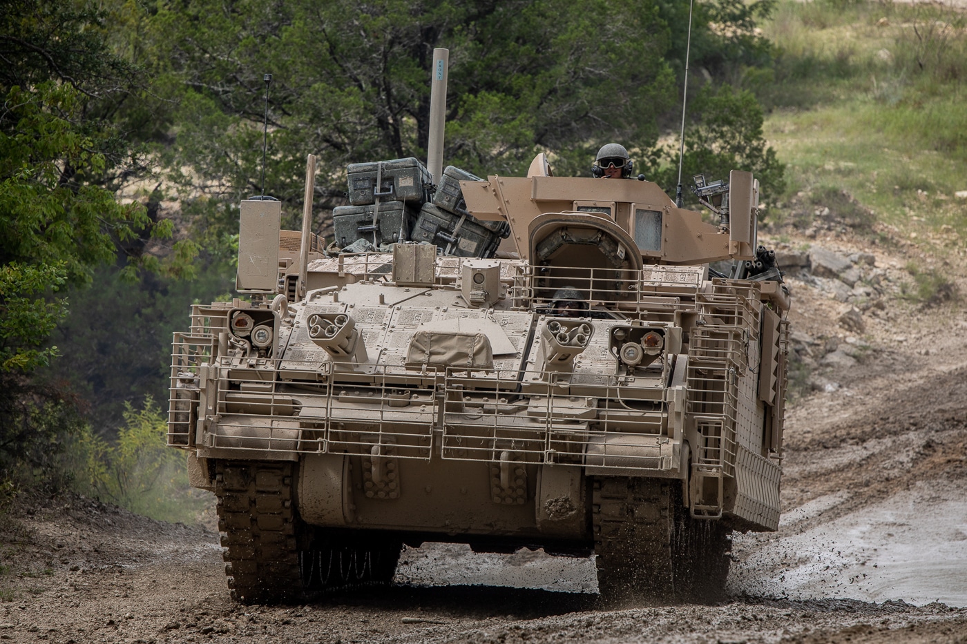 soldiers drive through a low-water crossing in the Armored Multi-Purpose Vehicle
