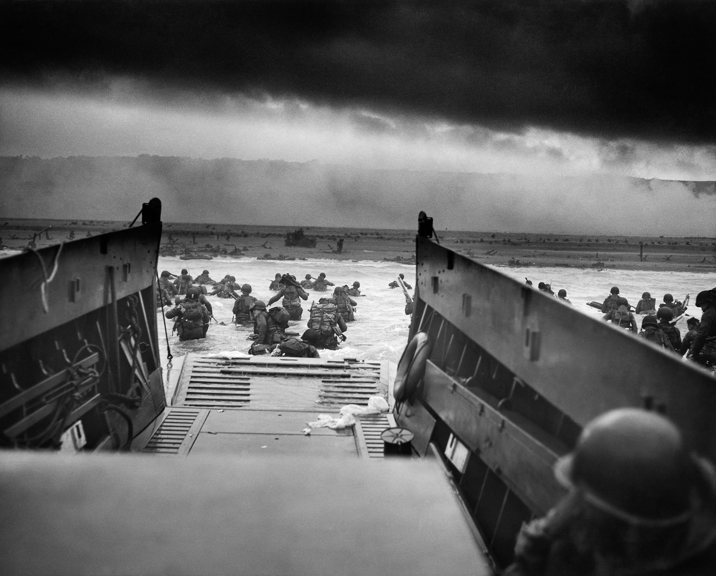 soldiers wade ashore at Omaha Beach