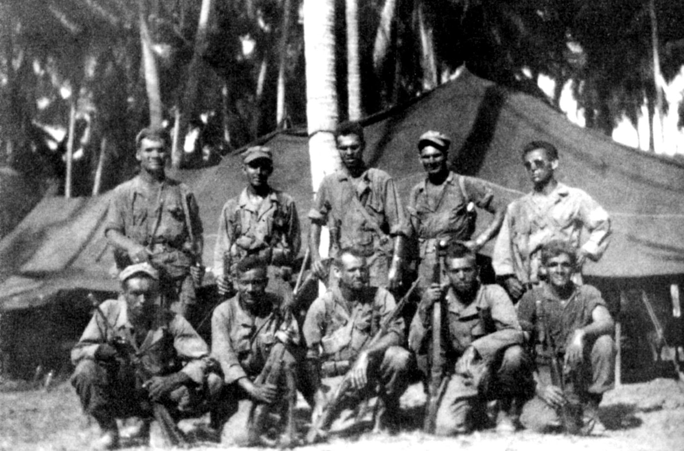 two teams of Alamo Scouts pose for a photo during World War II